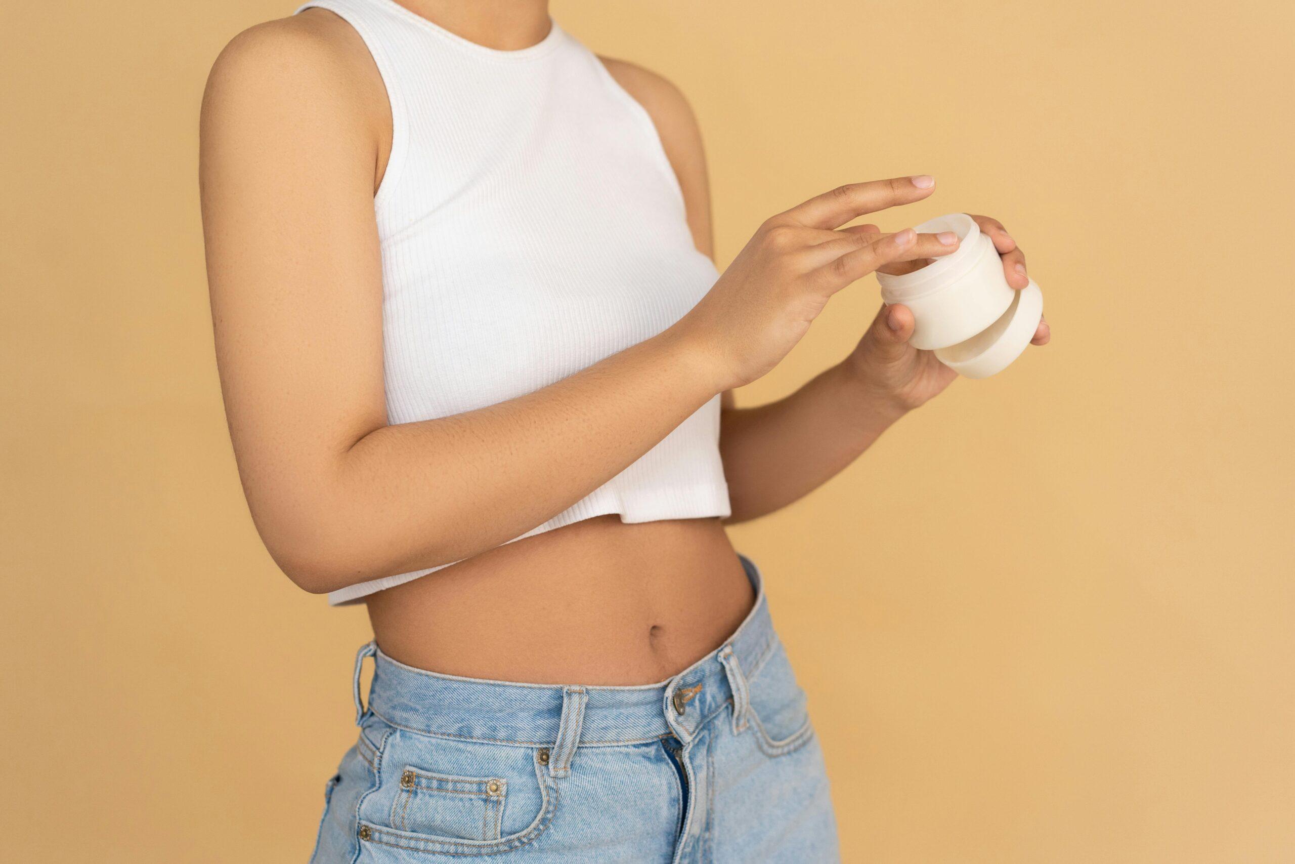 Before-and-after photos of a woman whose skin improved after using hibiscus-infused facial oil.