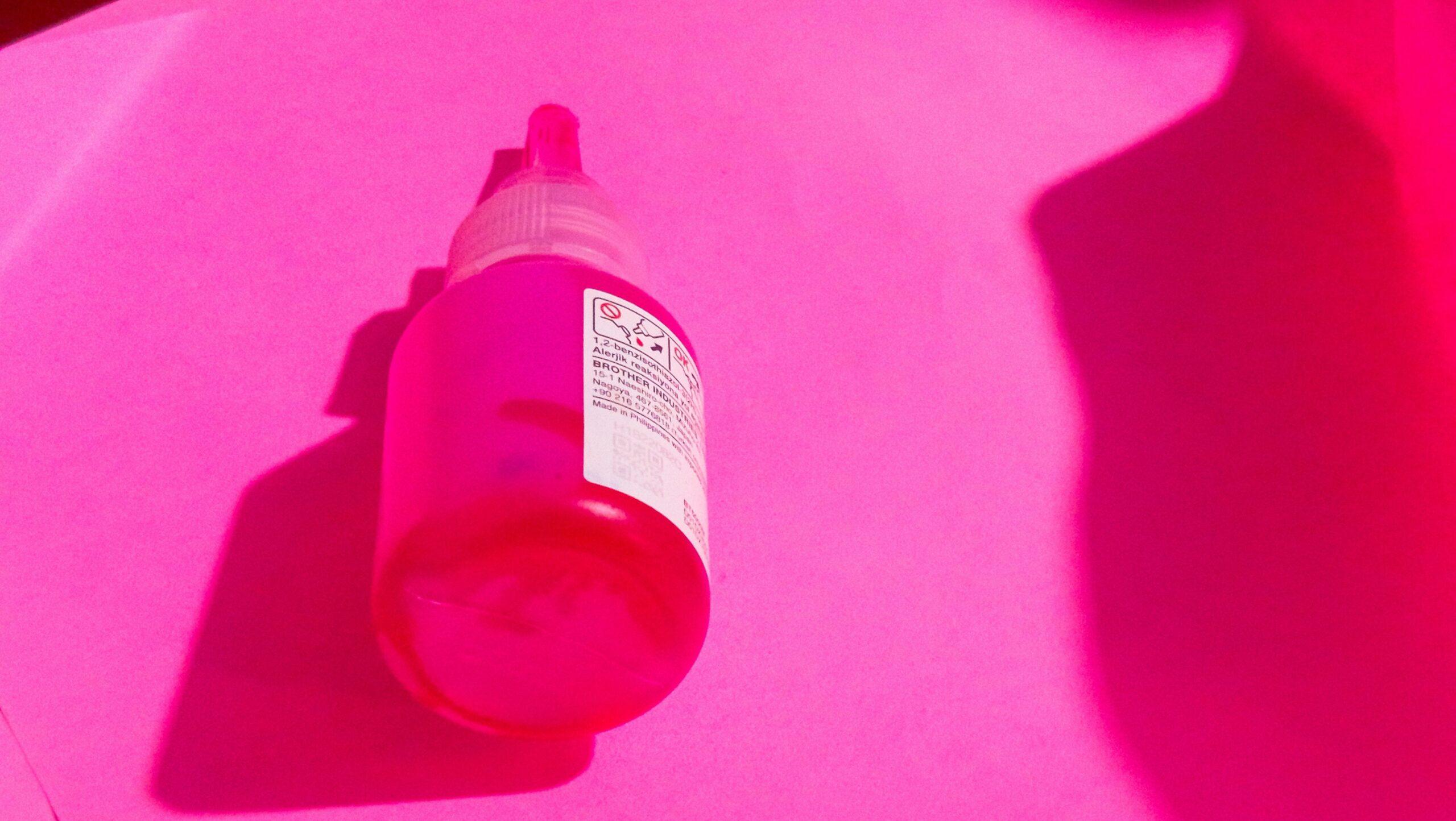 A close-up photo of a skincare bottle filled with artificial chemicals