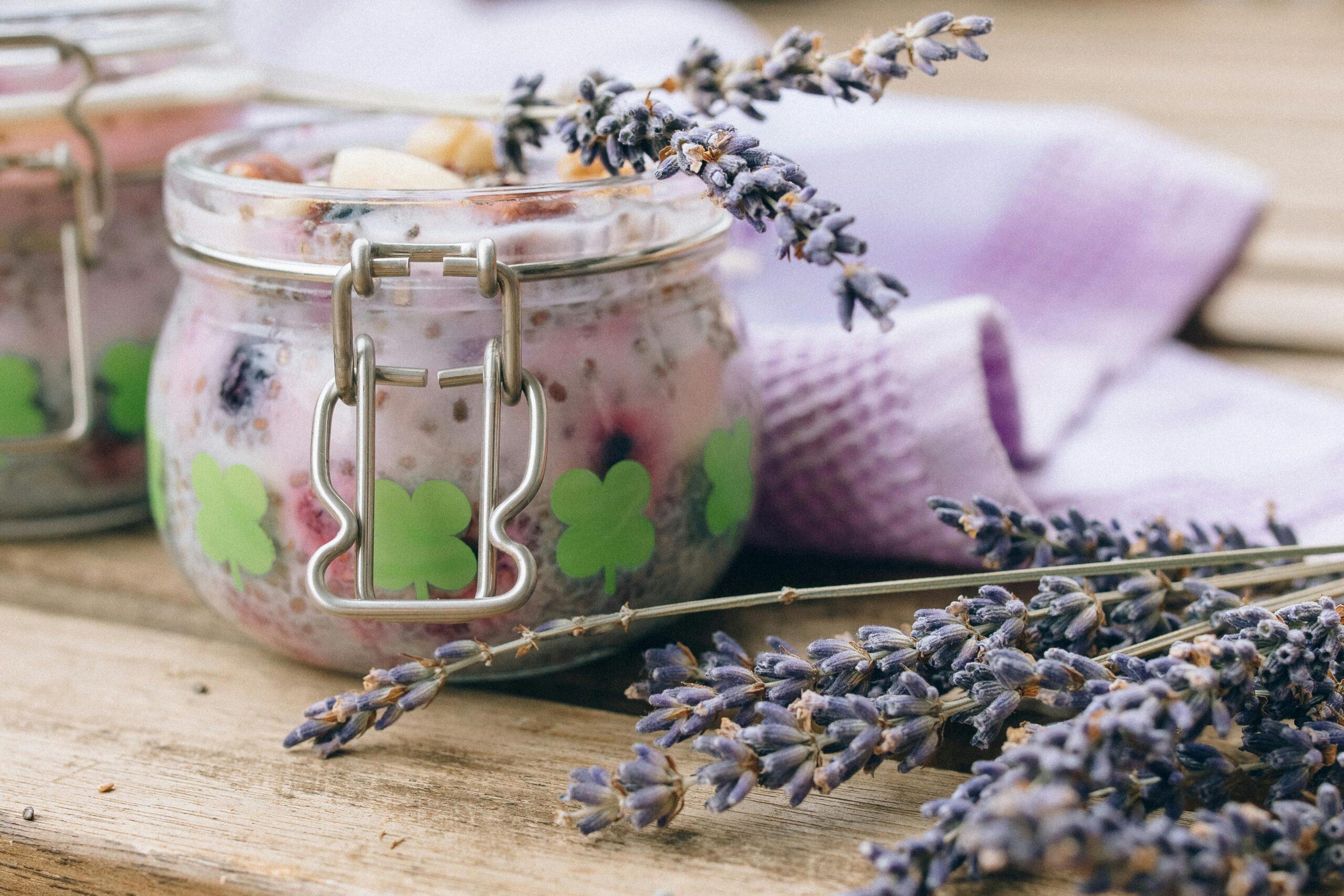 A DIY floral skincare kit featuring a glass jar labeled 'Calendula Infusion' next to fresh flowers