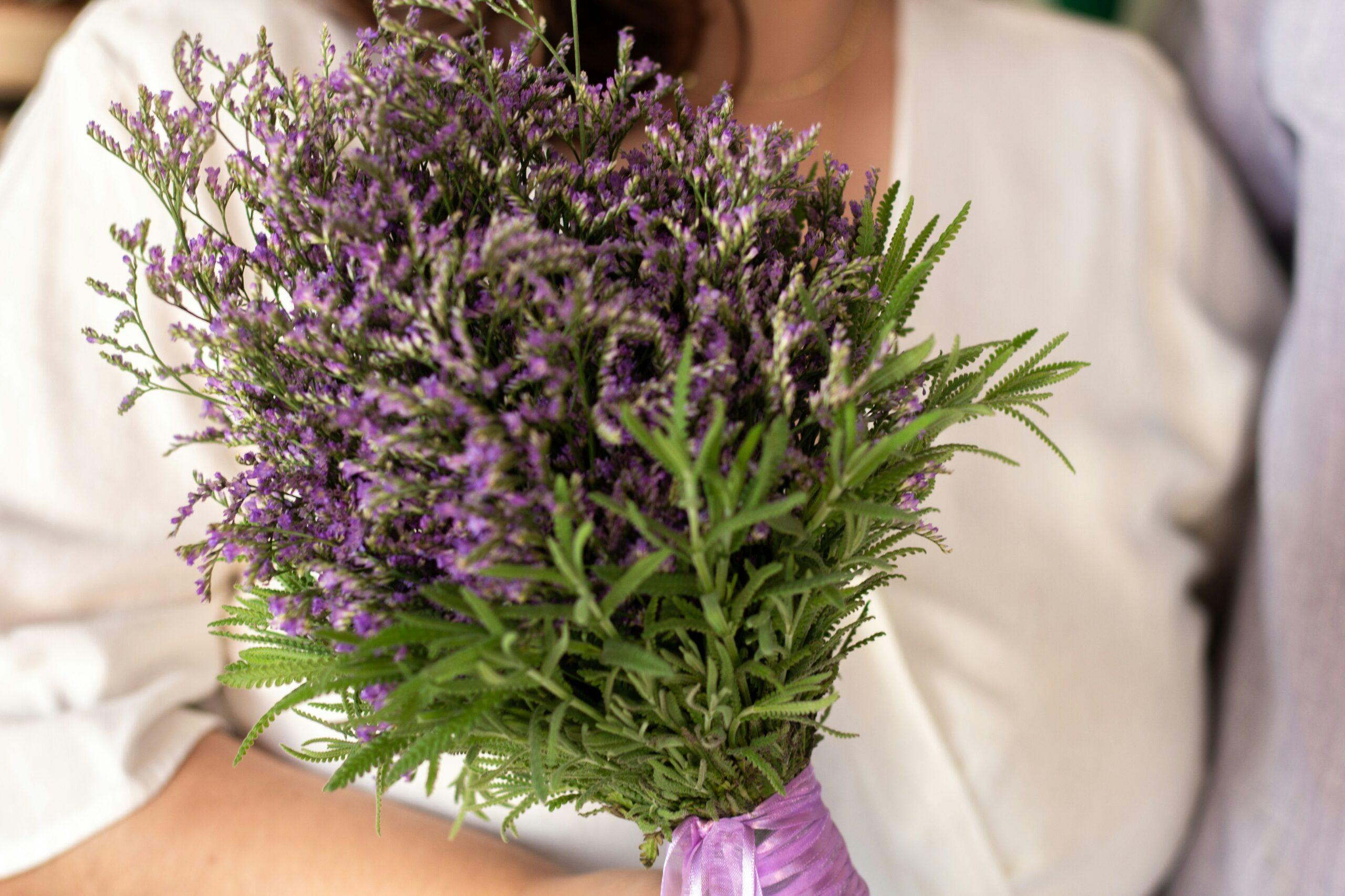 A vibrant bouquet of organic roses and lavender tied with biodegradable twine.