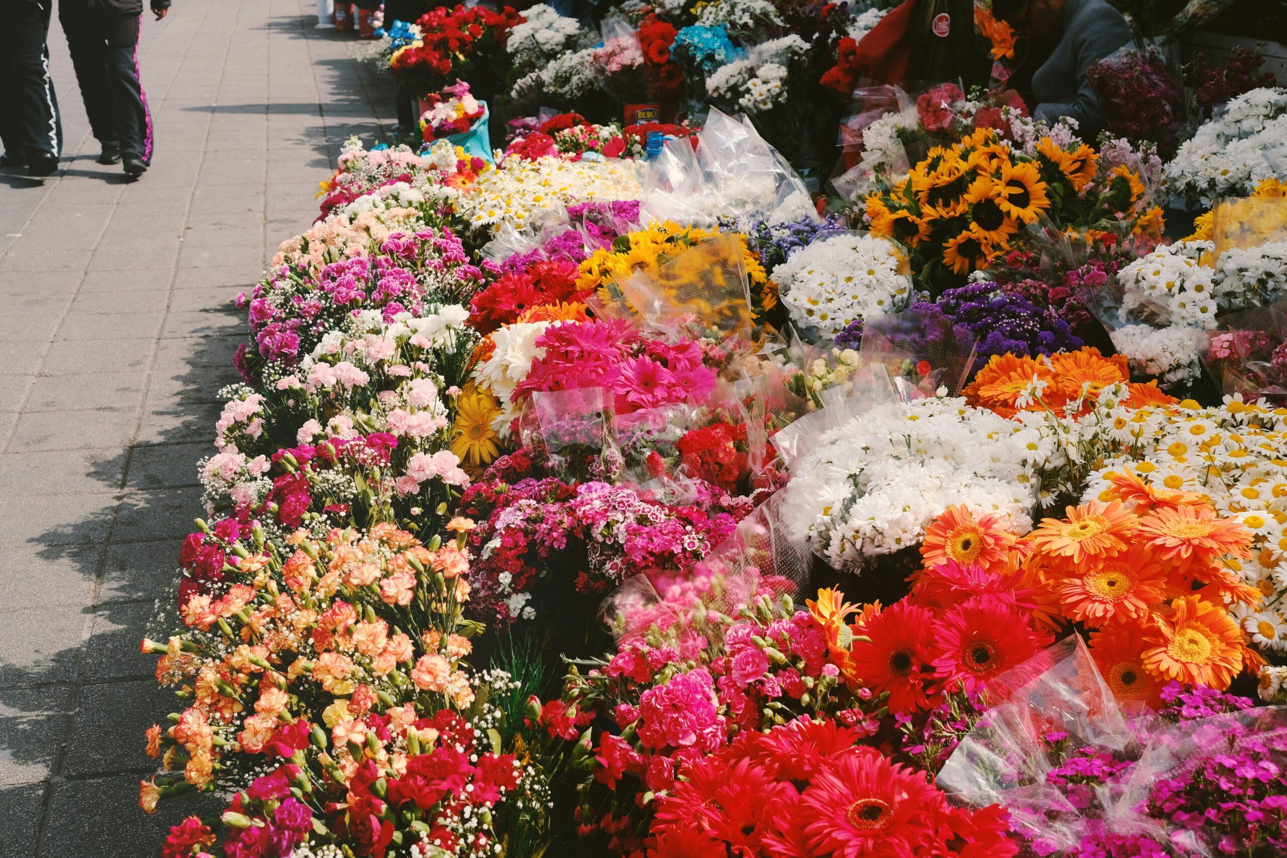 Organic flowers arranged neatly beside skincare products