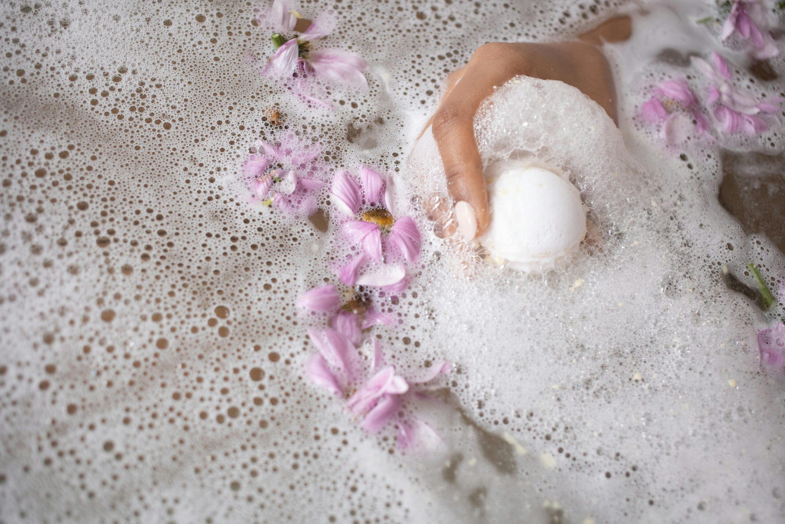 Woman picking fresh lavender flowers for organic skincare