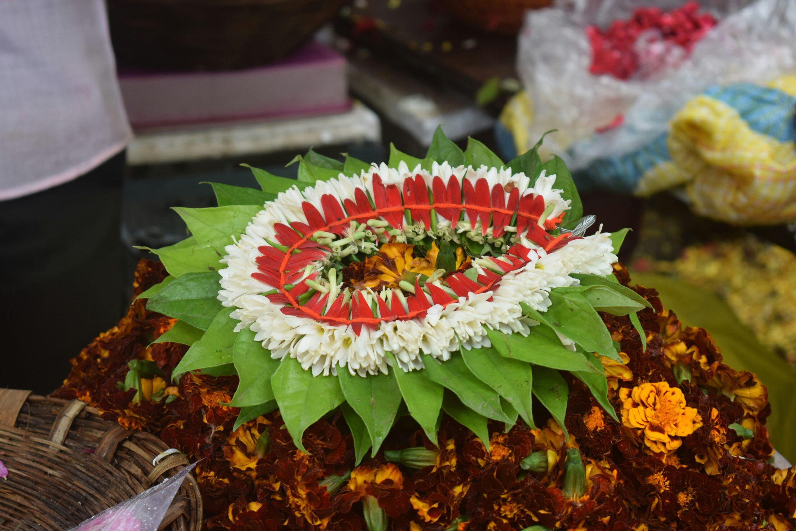 Arrangement of organic Christmas flowers decorating a wooden table