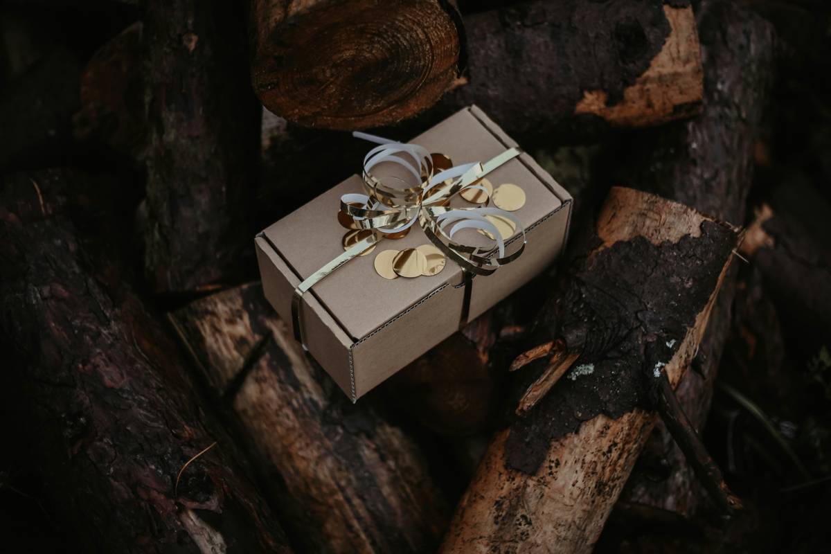 A beautifully arranged natural gift set containing rose oil, soap, and dried flower sachets