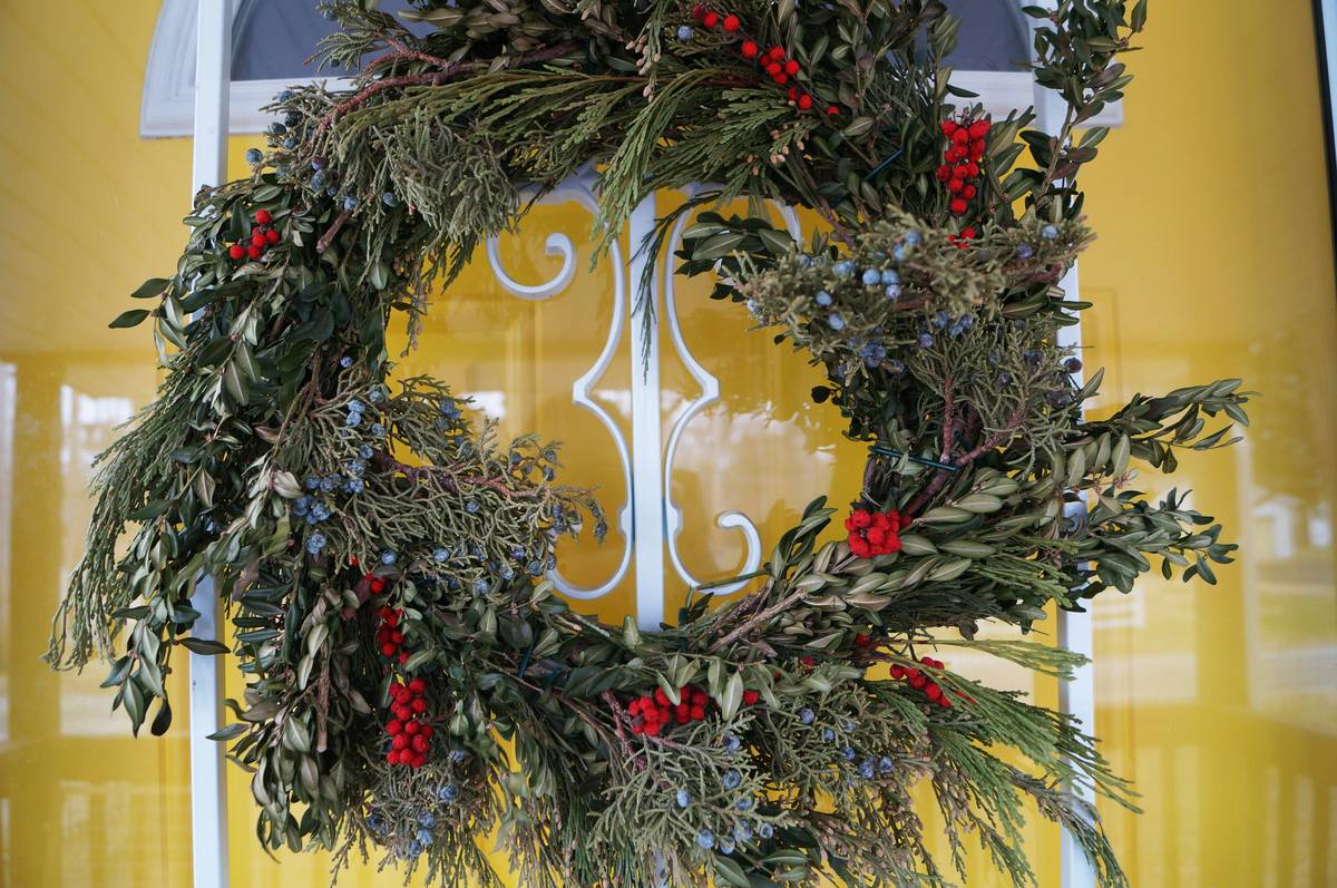 Winter wreath featuring hydrangeas against a snowy backdrop
